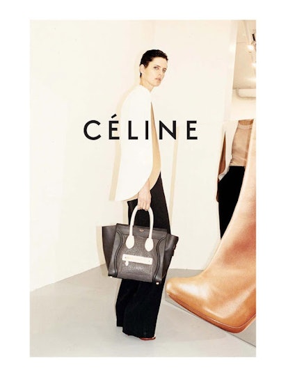 Celine 2011 poster with a model carrying a black-white t Bag by Celine