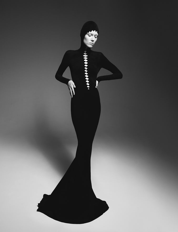 Kiki Willems wears an Alaïa hooded dress.
