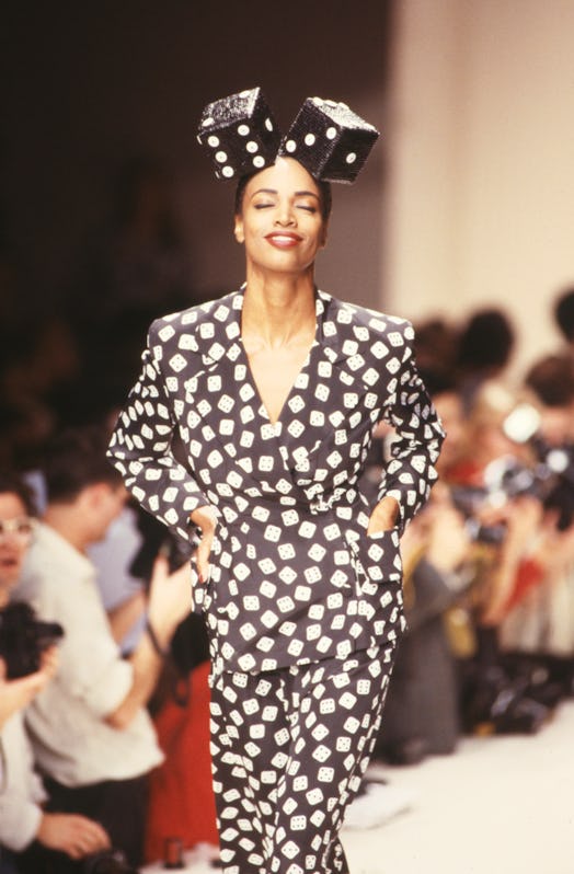 Model with dice on her head at a Patrick Kelly runway show