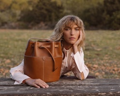 Arizona Muse with Anya Hindmarch's biodegradable leather bag.