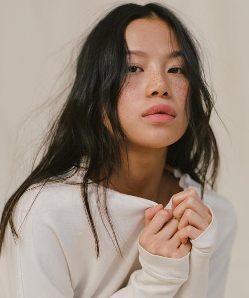 model with bare skin and long hair