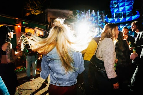 Woman out in nightclub.