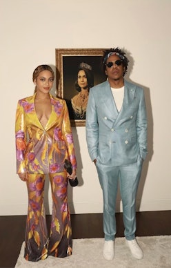 Beyoncé and Jay-Z wearing two-piece suits. 