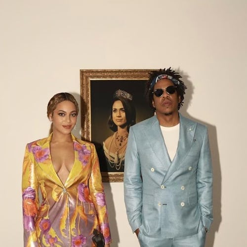 Beyoncé and Jay-Z wearing two-piece suits. 