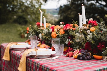Dinner table with fall centerpiece; florals and candles 