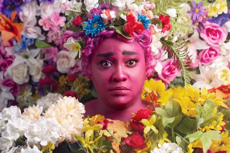 Jamila (aka Black Bettie Cosplay) cosplaying as a mashup of Dani from the film Midsommar and the god...