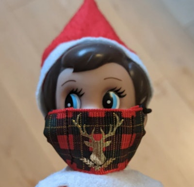 Elfie wearing a reindeer face mask