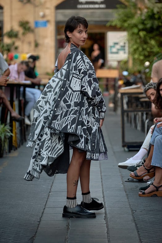 A model wearing an upcycled dress by rising designer David Weksler in black and white