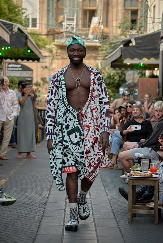 A model wearing an upcycled black-white-red dress by rising designer David Weksler