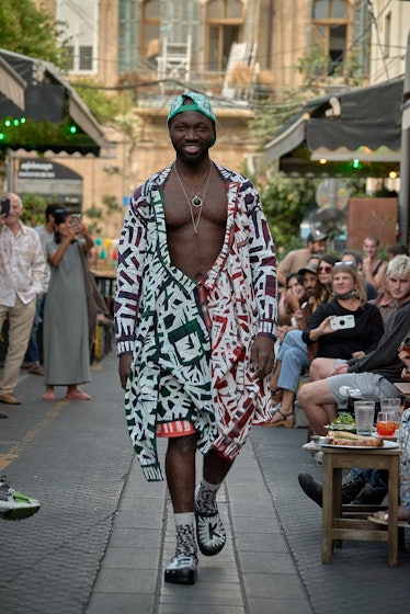 Model wearing upcycled multicolored look