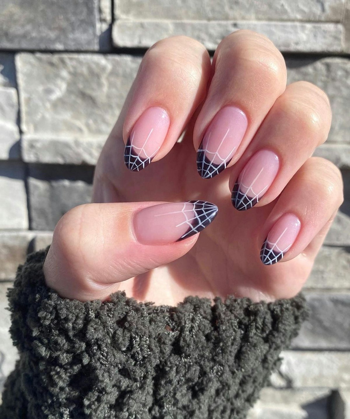 From candy corn to ghosts to spider webs, these spooky manicures (like these spider web nails) are h...