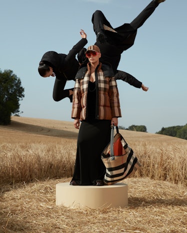 Irina Shayk wearing burberry with flying models in a wheatfield