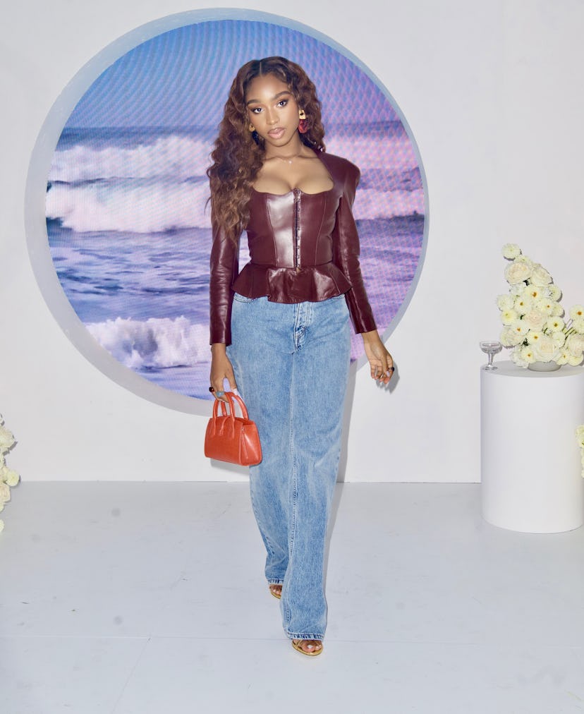 Normani Stuns in Burgundy Leather Top as she Supports Lori Harvey at the Launch of her 'SKN by LH' L...