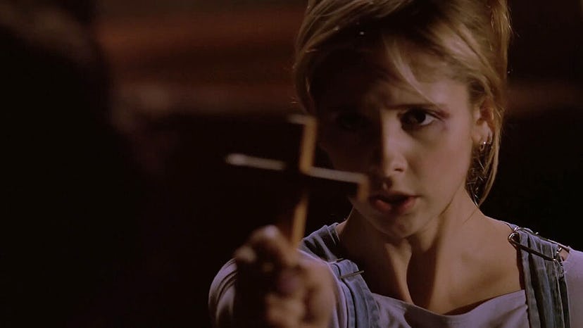 Buffy Summer holds a cross in "Helpless."