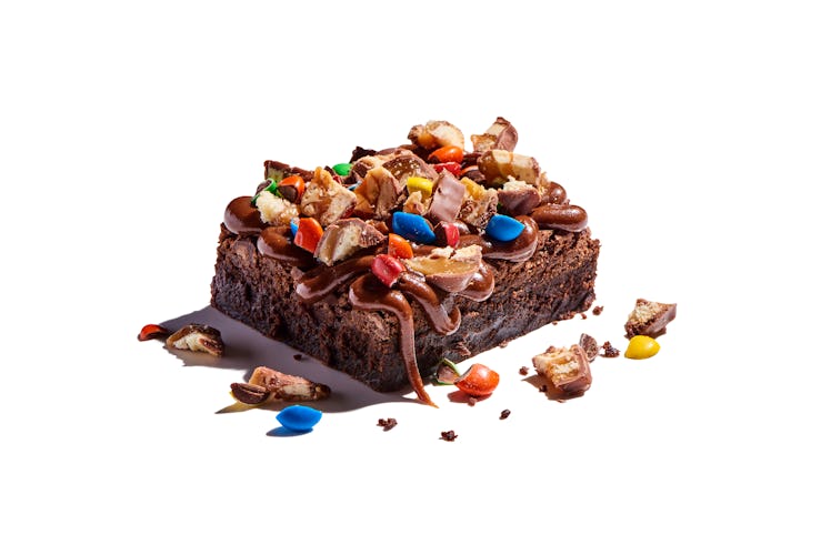 The Tricked Out Loaded Brownie comes with a cookie butter coating and a M&M's, Twix, and Snickers ga...
