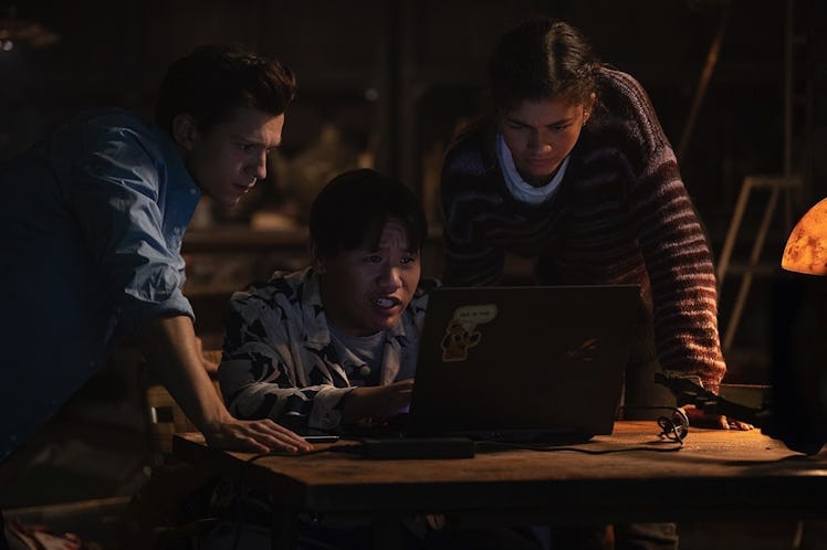 Tom Holland, Jacob Batalon, and Zendaya looking at a computer in Spider-Man: No Way Home