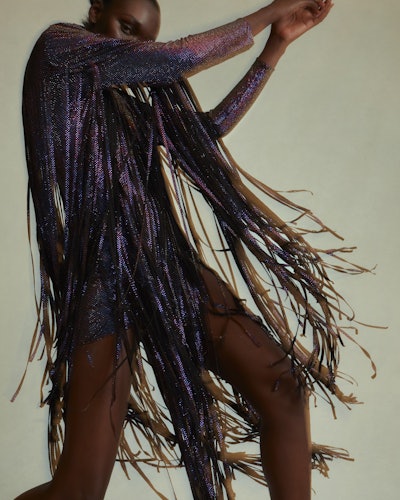 Model wearing grey metallic fringe dress