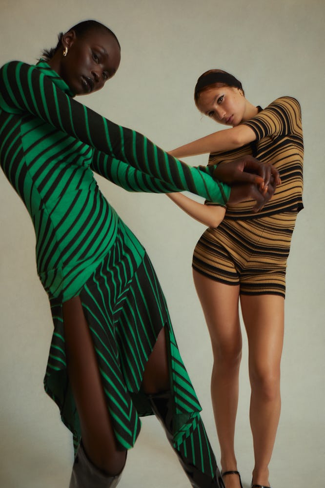 Two models wearing striped clothing