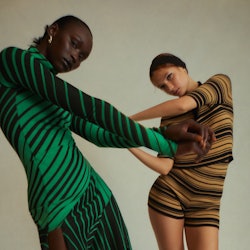 Two models wearing striped clothing