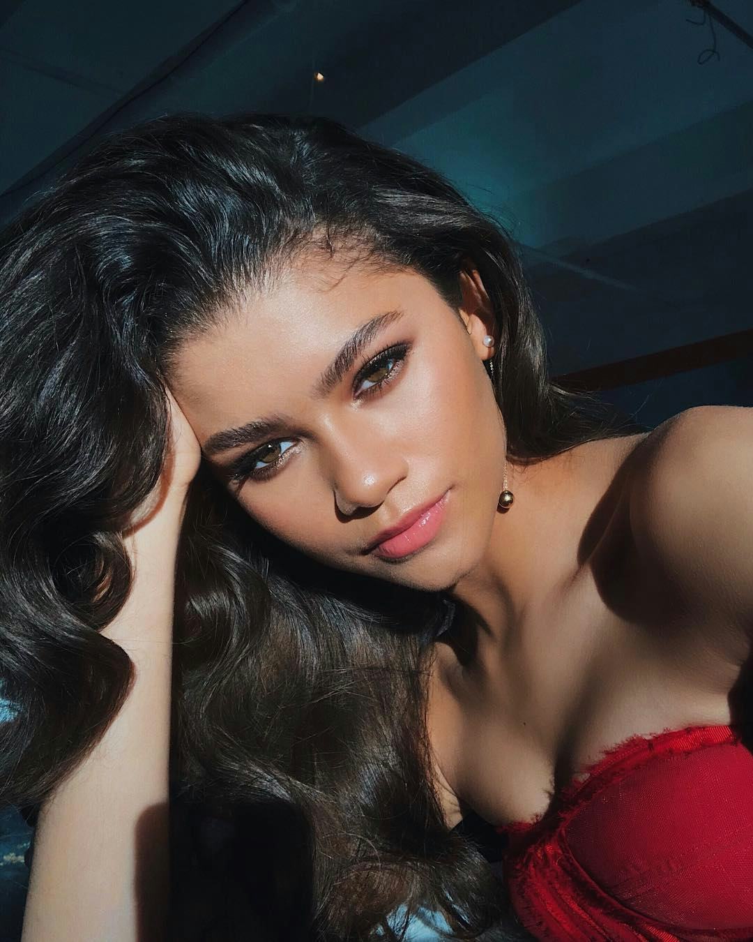 Zendaya with dark old hollywood curls close-up selfie