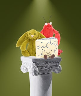 Three characters from jellycat on a pedestal 