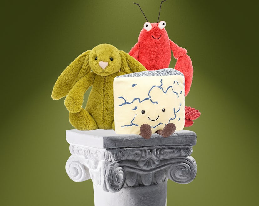 Three characters from jellycat on a pedestal 