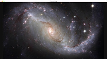Go to the galaxy with this space Zoom background. 
