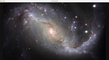 Go to the galaxy with this space Zoom background. 