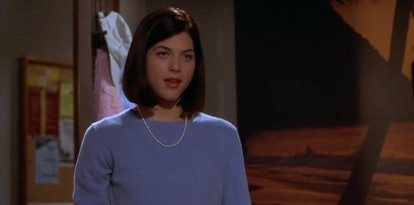 Selma Blair wears a blue cashmere sweater and pearls often in Legally Blonde.