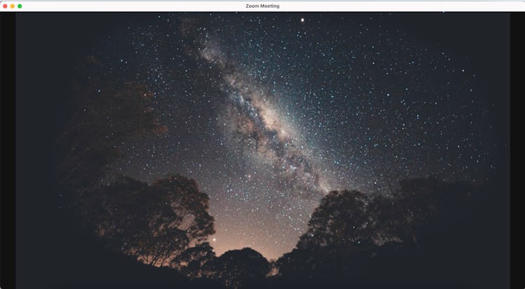 This space Zoom background is a photo of the night sky from Earth. 
