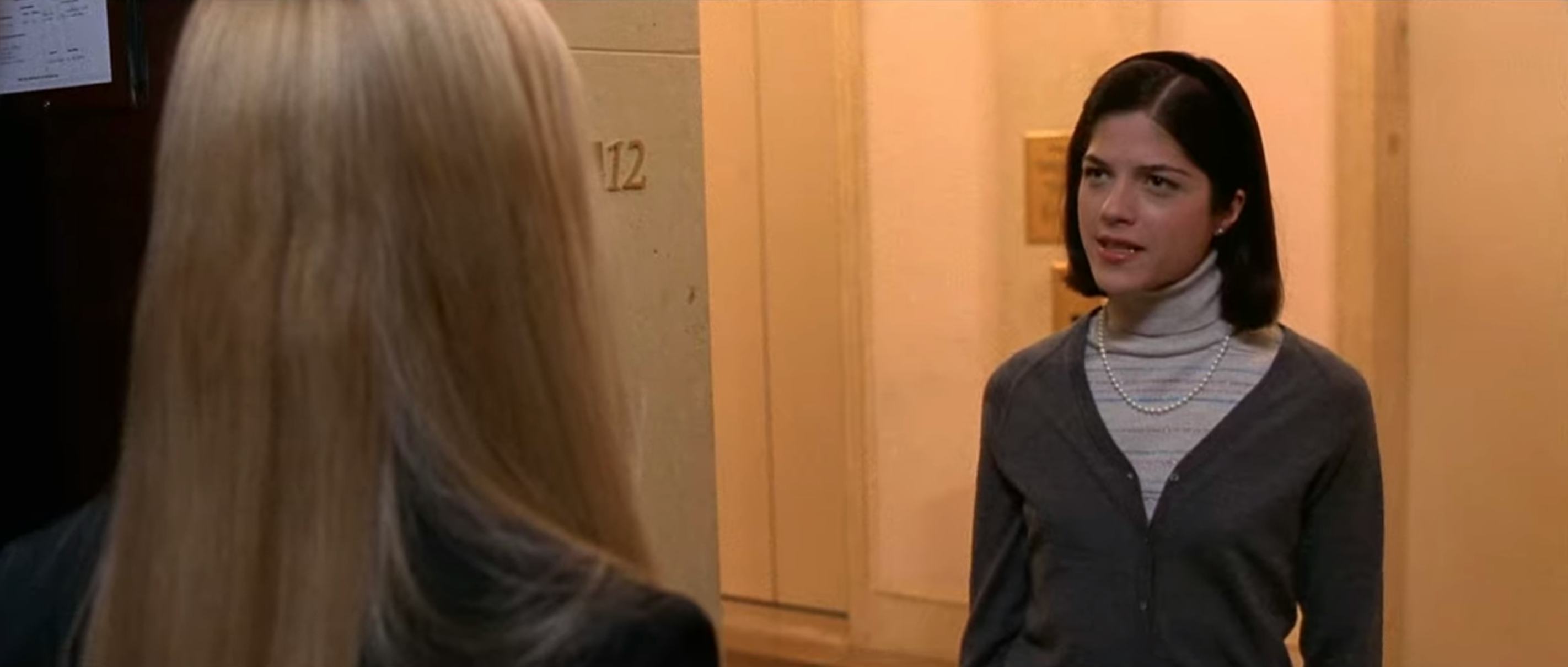 Vivian Kensington layers turtlenecks and cardigans in Legally Blonde.