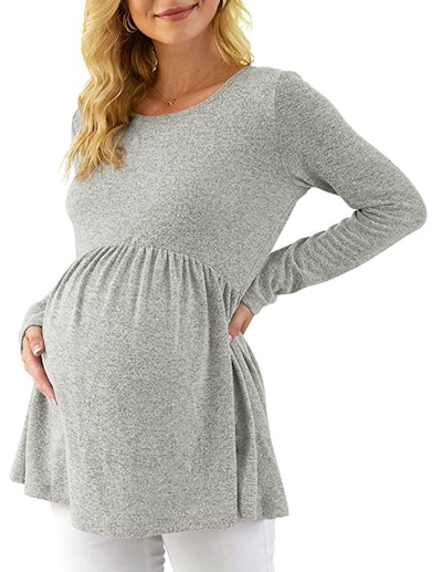 Pregnant woman modeling grey top 