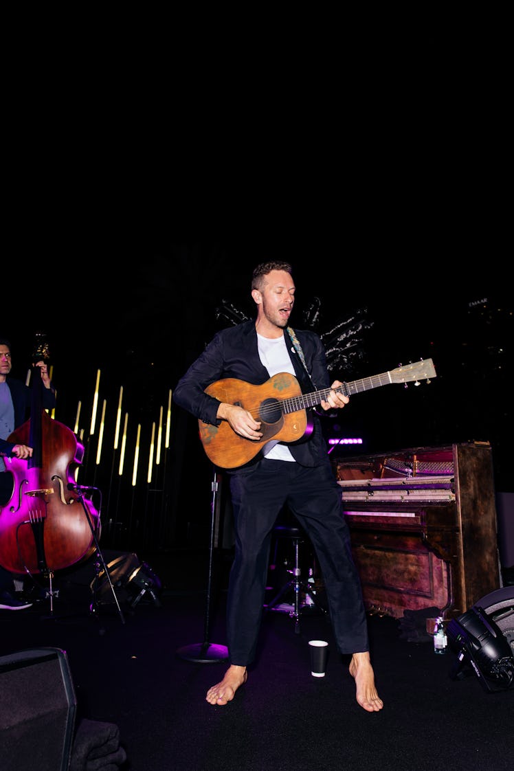 Chris Martin performing barefoot