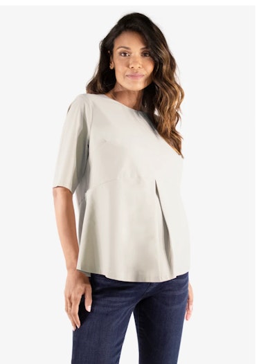 Pregnant woman modeling beige short sleeve blouse 