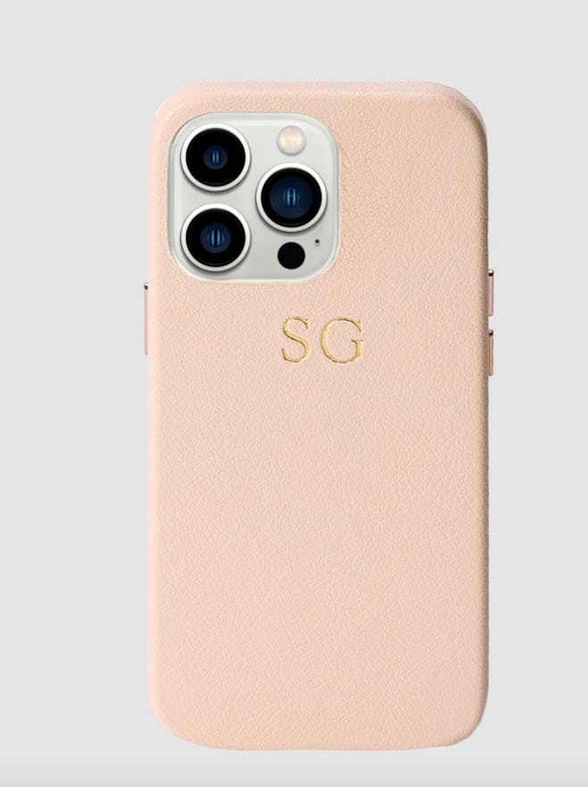 The Daily Edited's pale pink pebbled wrap iPhone 13 Pro case. 
