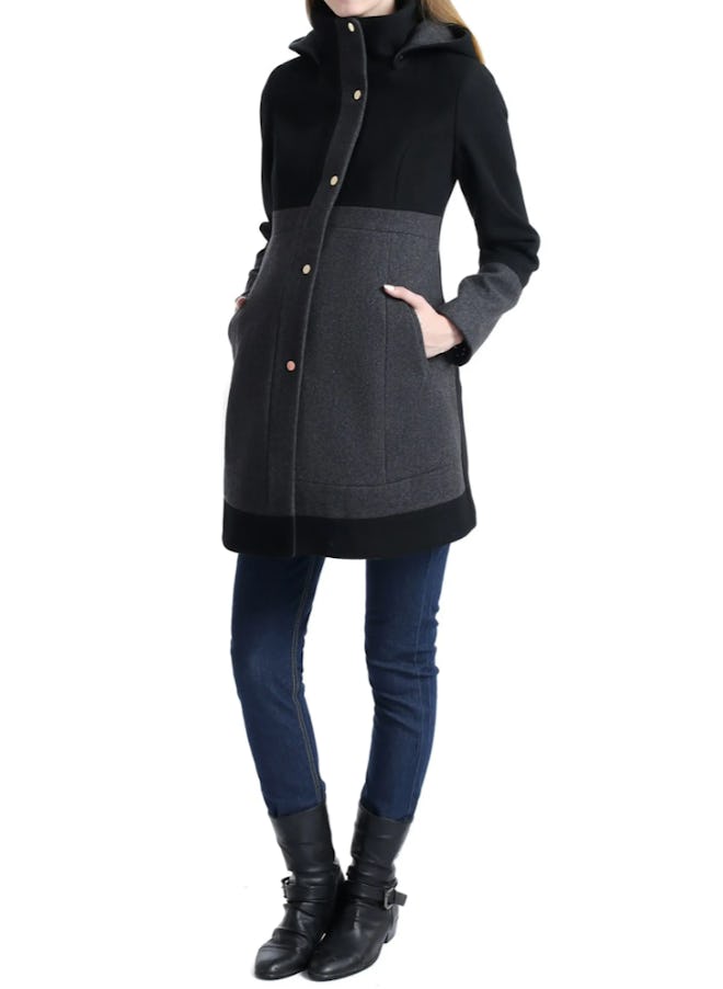 Pregnant woman modeling black winter coat