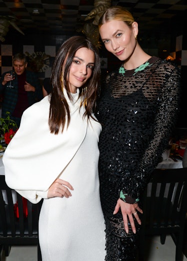 Karlie Kloss in a black lace dress and Emily Ratajkowski in a white dress