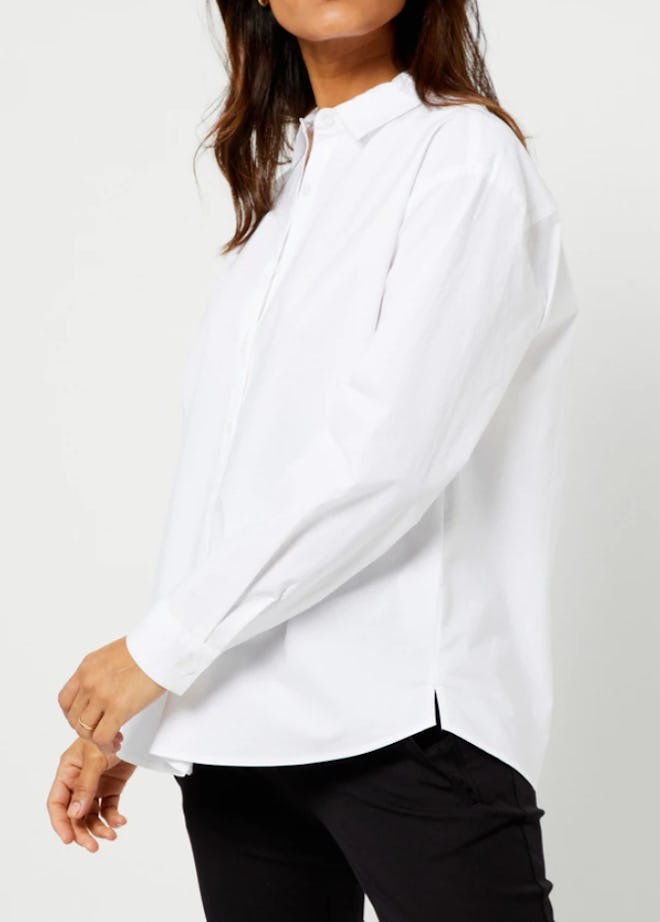 Pregnant woman modeling white dress shirt