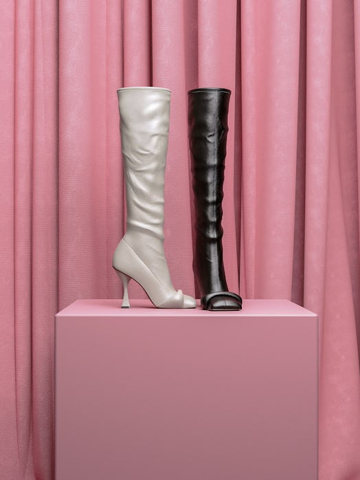 Hanifa  boots in black and white on a pink podium