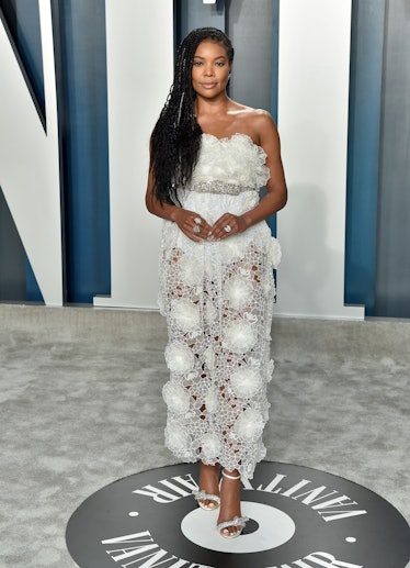 Gabrielle Union in a white lace dress at the Vanity Fair Oscars Party 