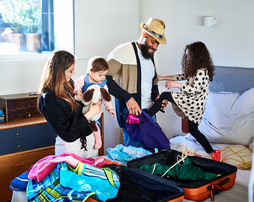 Parents packing with their kids for a vacation