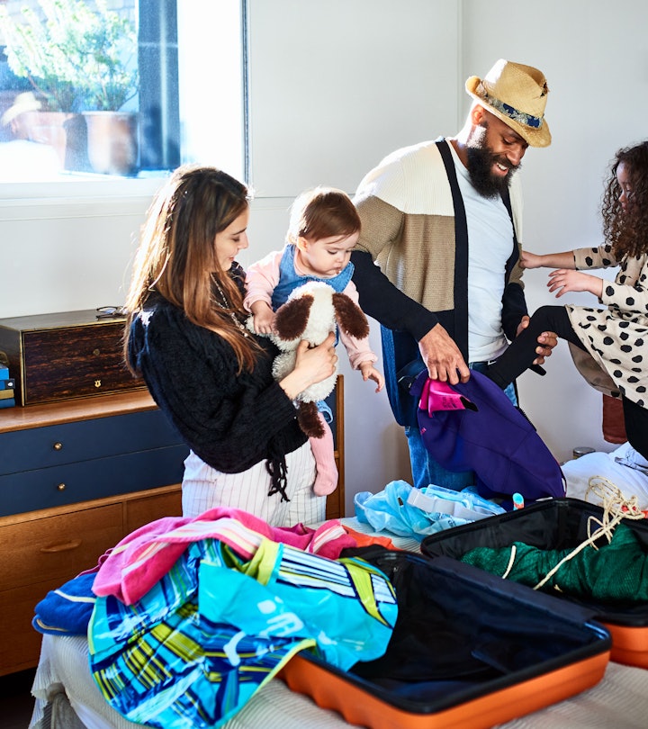 Parents packing with their kids for a vacation