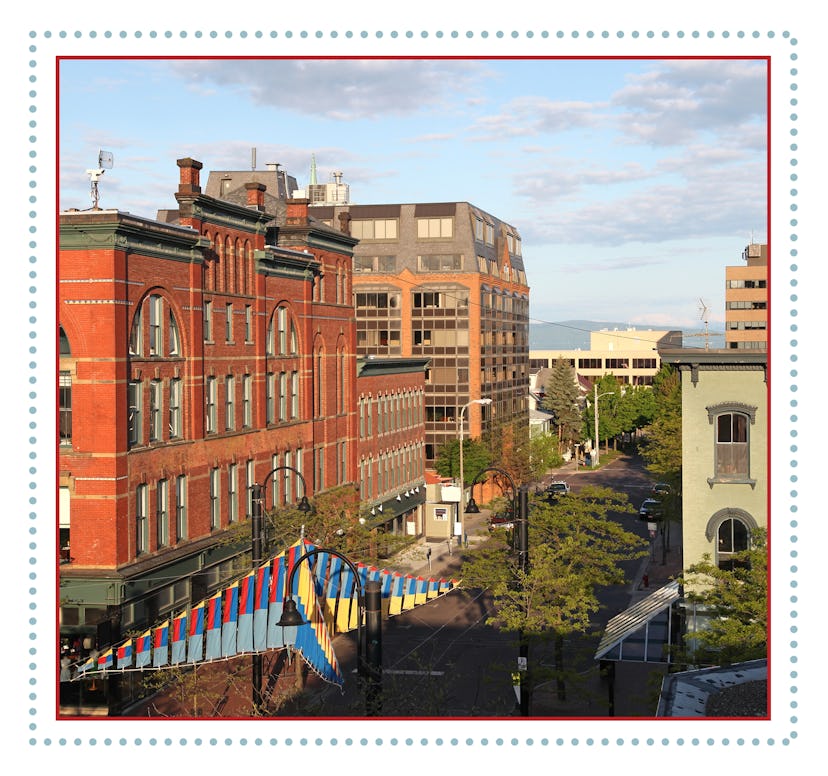 People walk along Church street in Burlington, Vermont.