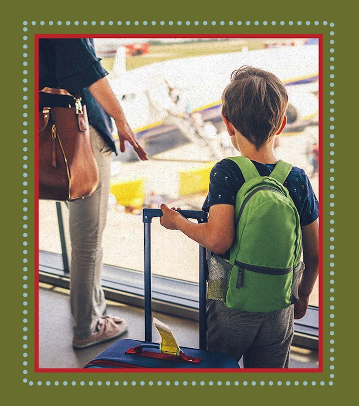 A mother standing next to her child at the airport before their Holiday travel