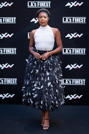 Gabrielle Union in a white-black polka-dot top and black-white feather skirt at L.A.’s Finest Photoc...
