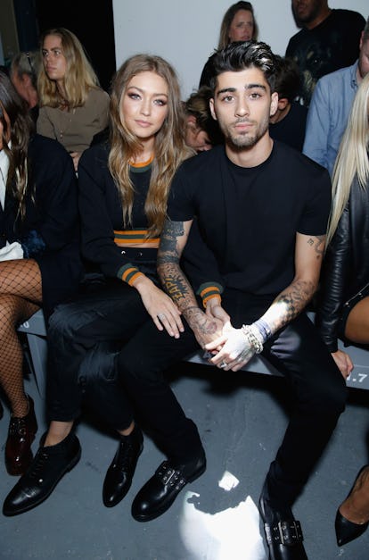 Gigi Hadid and Zayn Malik attend the Versus Versace show during London Fashion Week