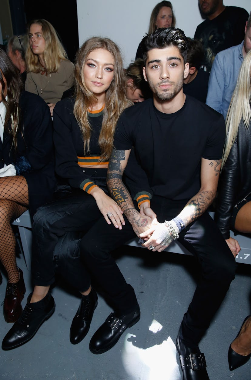 Gigi Hadid and Zayn Malik attend the Versus Versace show during London Fashion Week