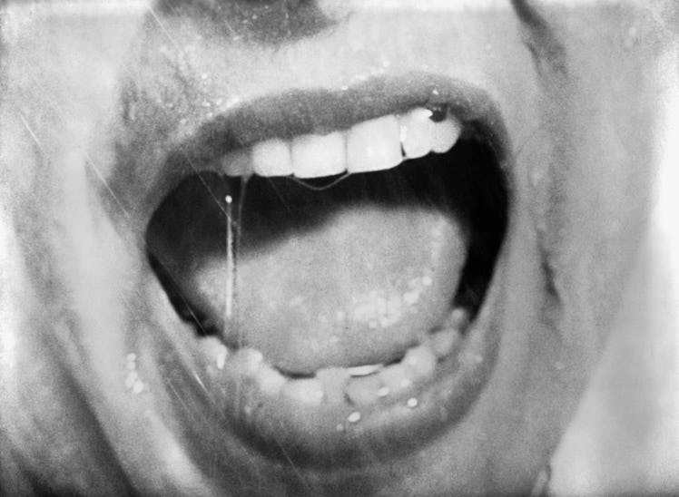 Close-up of a screaming mouth from Alfred Hitchcock's "Psycho." Movie still, 196