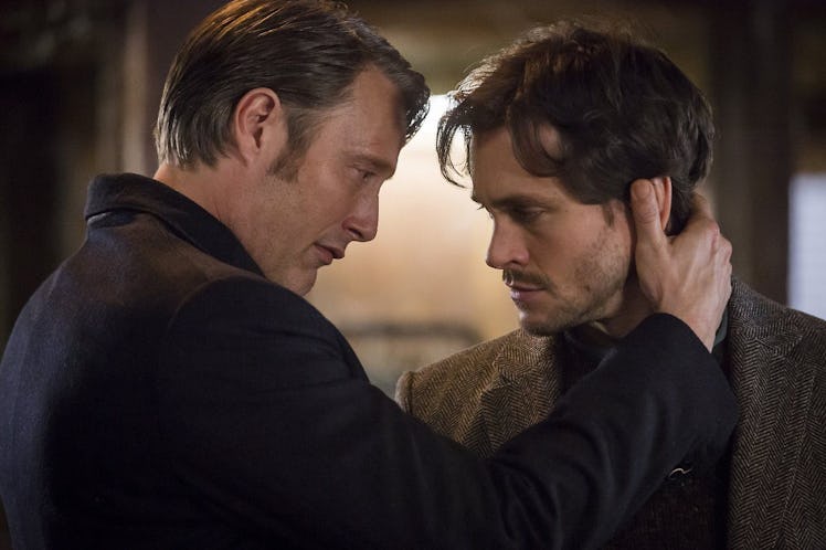 Hannibal has his hand on Will's neck