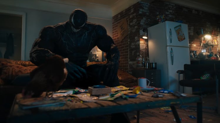 Venom and Eddie hang out in Eddie’s apartment with Venom’s pet chicken.